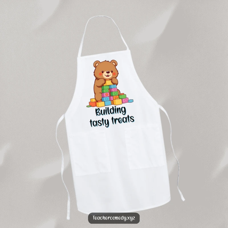 Funny bear apron depicting a determined bear building a tower of colorful blocks, ideal for a humorous cooking experience.
