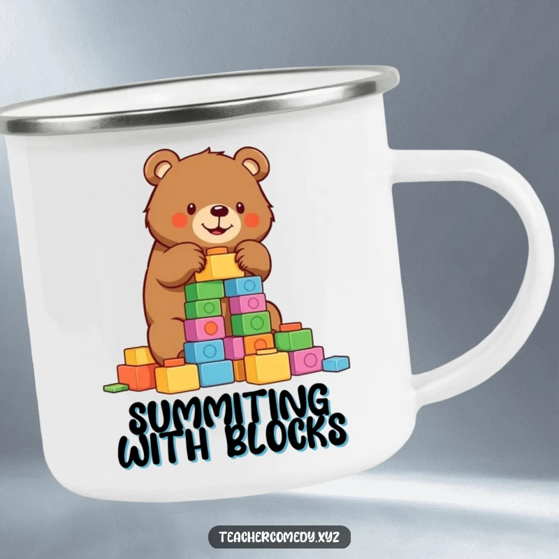 Funny bear camping mug showing a determined bear building a tower of colorful blocks, ready for outdoor projects and laughs.