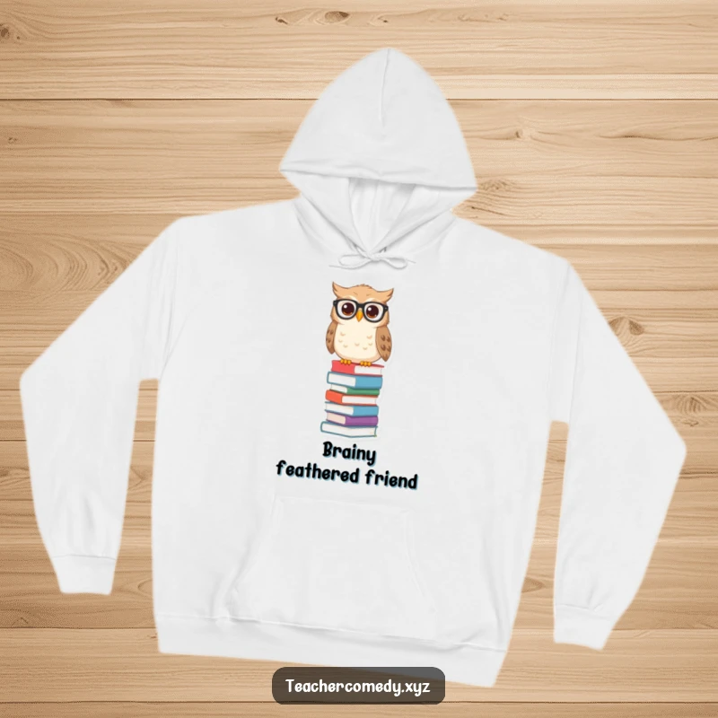 Funny owl hoodie with spectacles on a tall stack of books, offering warmth and a symbol of scholarly pursuits.