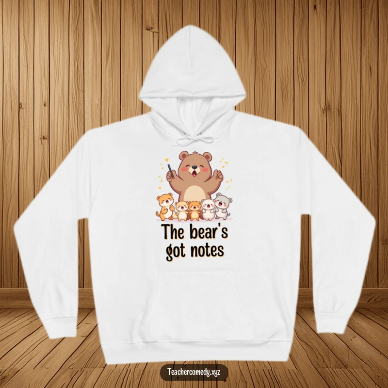 A determined bear leading a group of small, happy animals in a song, depicted on a soft and warm hoodie for ultimate comfort.