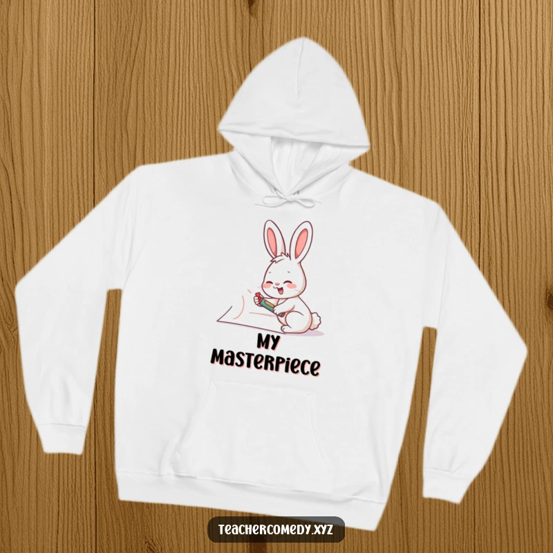 Funny rabbit artist hoodie, showing a giggling rabbit writing on a giant piece of paper with a crayon, perfect for creative comfort.