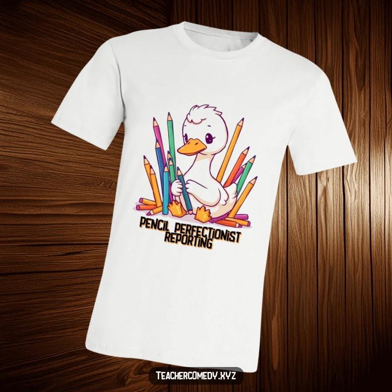 Funny t-shirt featuring a focused goose meticulously organizing colorful pencils, highlighting orderly, humorous dedication.